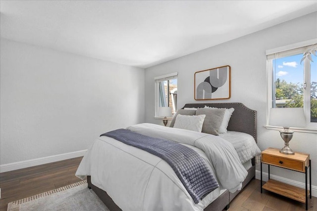 bedroom featuring dark wood-type flooring