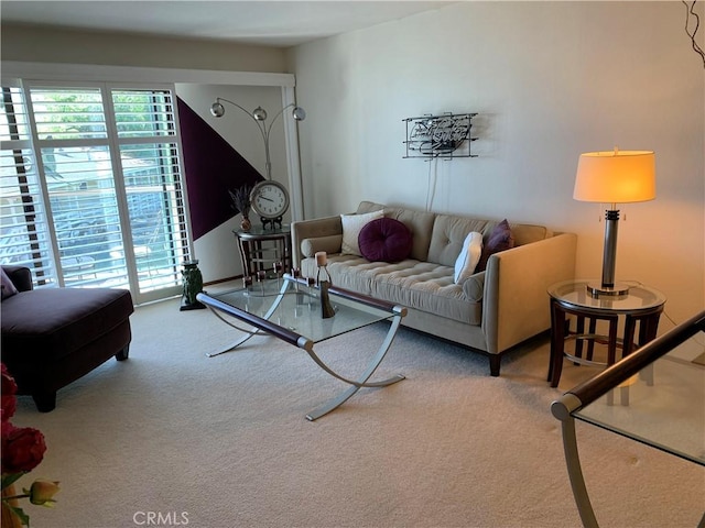 carpeted living room featuring a healthy amount of sunlight