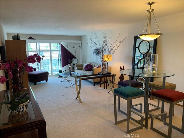 dining room featuring light colored carpet