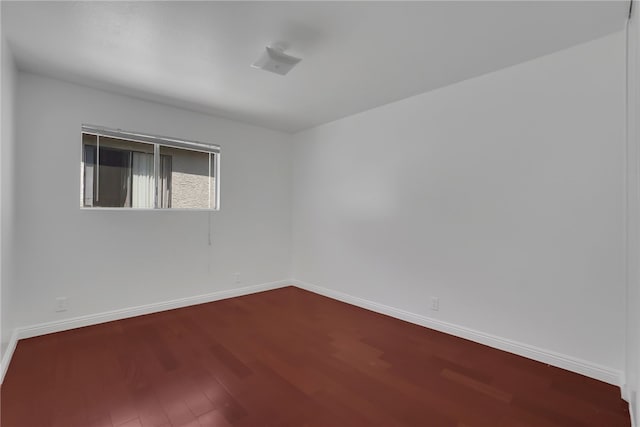 empty room featuring hardwood / wood-style flooring