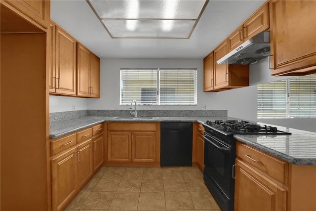 kitchen with light tile patterned flooring, sink, and black appliances