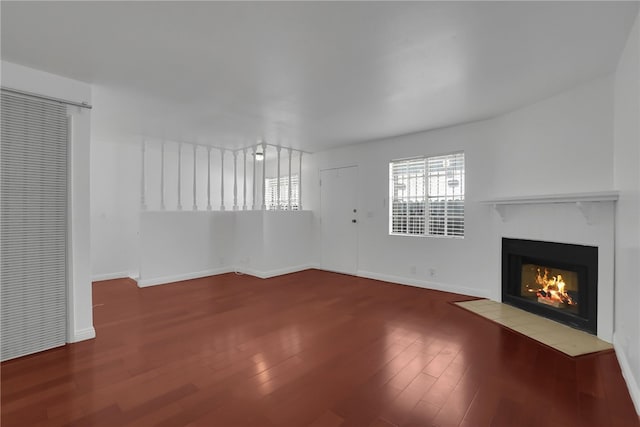 unfurnished living room with hardwood / wood-style floors