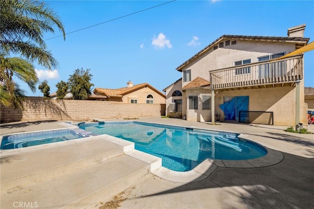 view of swimming pool with an in ground hot tub, a patio area, a fenced backyard, and a fenced in pool