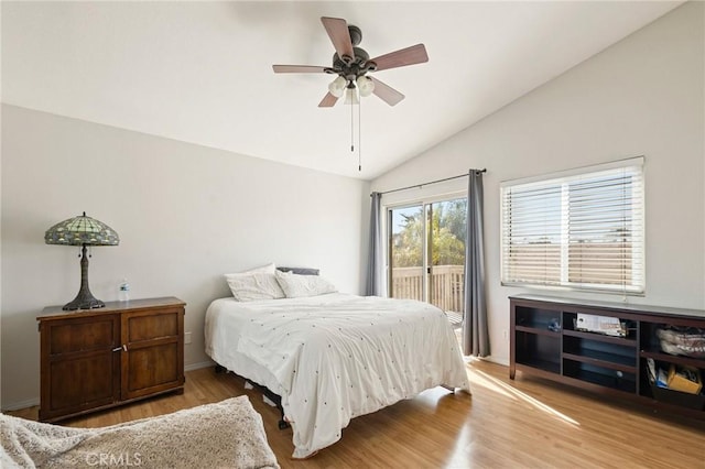 bedroom with lofted ceiling, access to outside, ceiling fan, and wood finished floors