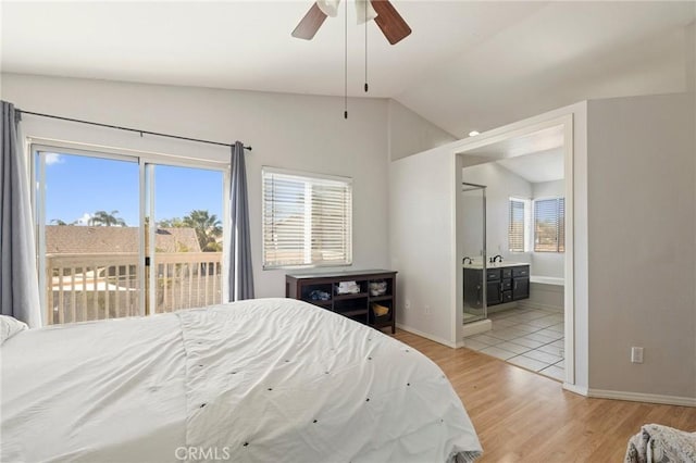 bedroom with ensuite bathroom, baseboards, vaulted ceiling, access to outside, and light wood-style floors