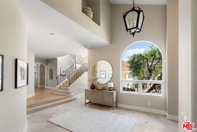 foyer with a towering ceiling