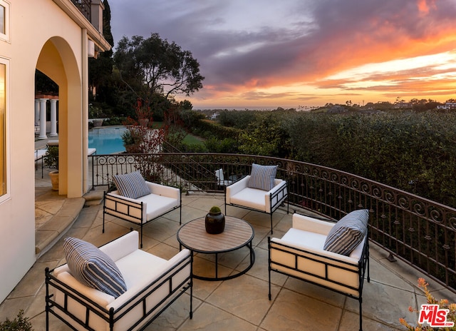 patio terrace at dusk with an outdoor hangout area