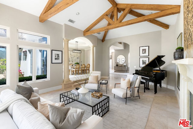 tiled living room with decorative columns, high vaulted ceiling, and beam ceiling