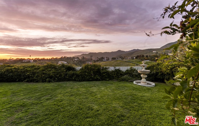 yard at dusk with a mountain view