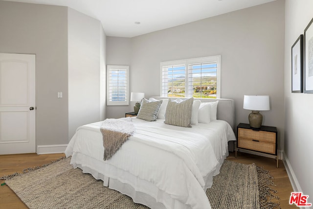 bedroom featuring hardwood / wood-style floors