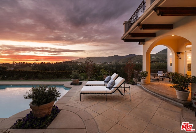 patio terrace at dusk with a mountain view