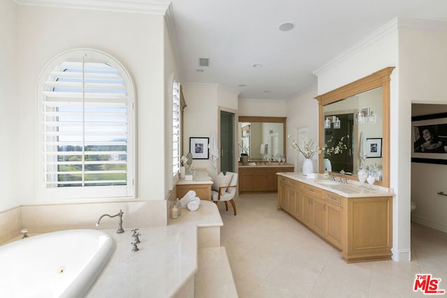 bathroom featuring vanity, a washtub, crown molding, and tile patterned floors