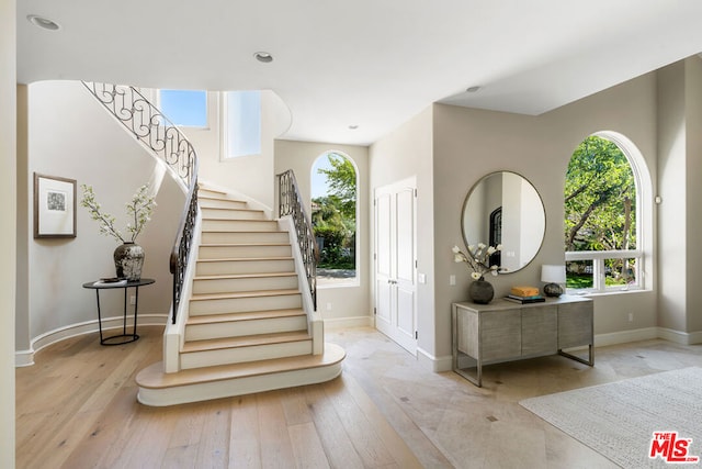 entrance foyer with light hardwood / wood-style flooring