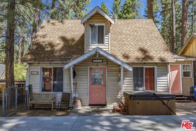 view of front of property featuring a hot tub