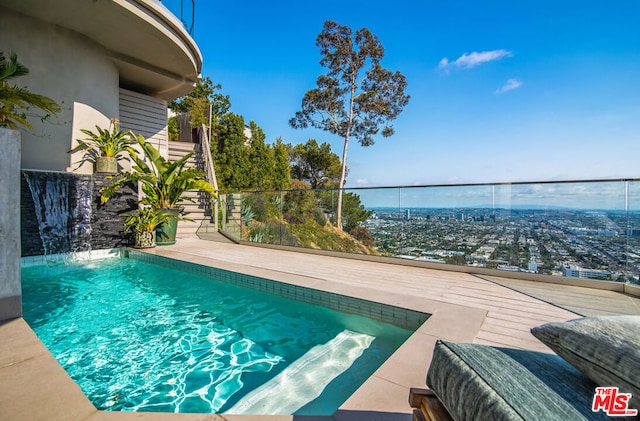 view of pool with pool water feature