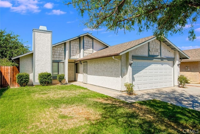 view of front of home featuring a garage and a front yard