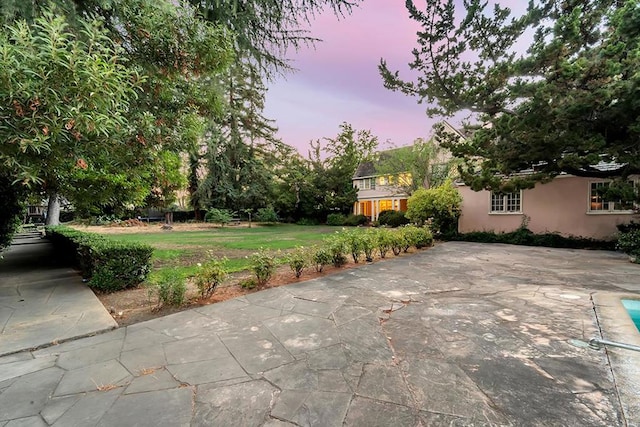 view of patio terrace at dusk