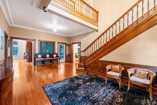 entrance foyer featuring hardwood / wood-style floors and ornamental molding