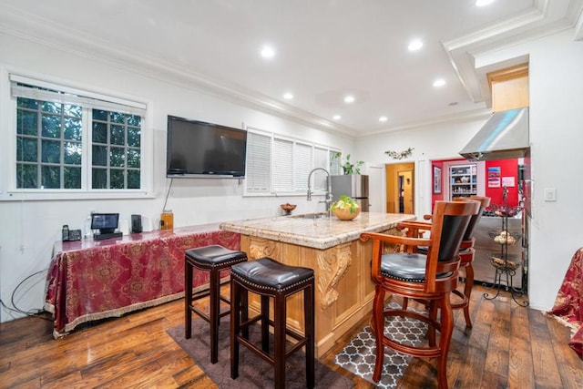 kitchen featuring stainless steel fridge, crown molding, dark wood-type flooring, and sink