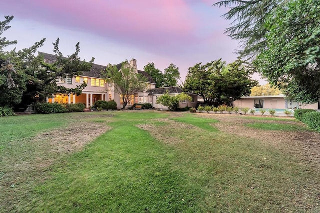 view of yard at dusk