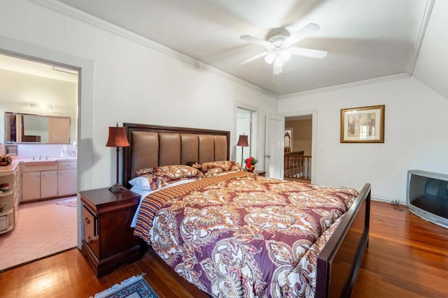 bedroom featuring ensuite bathroom, ceiling fan, dark hardwood / wood-style floors, and ornamental molding