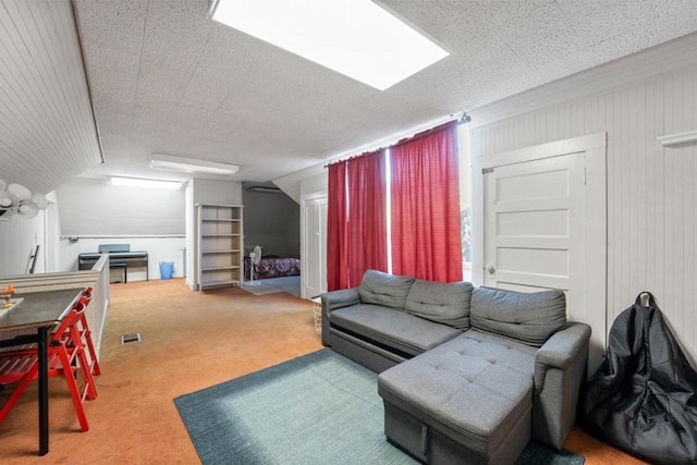 carpeted living room featuring a textured ceiling and vaulted ceiling