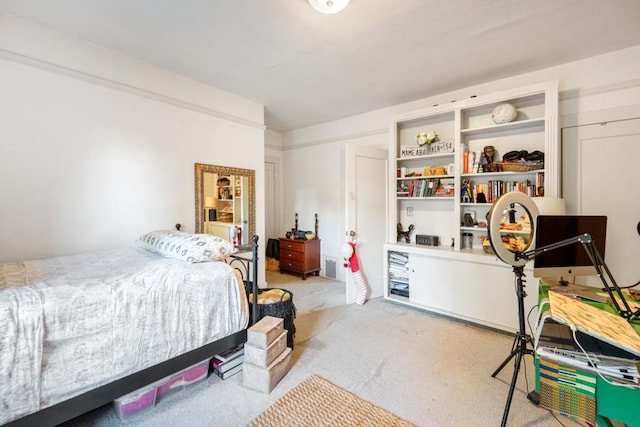 bedroom featuring light colored carpet