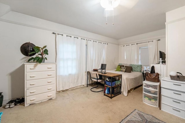 bedroom featuring light carpet