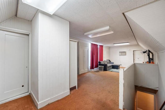 bonus room featuring carpet and vaulted ceiling