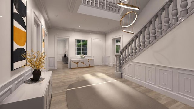 entrance foyer with crown molding and light wood-type flooring