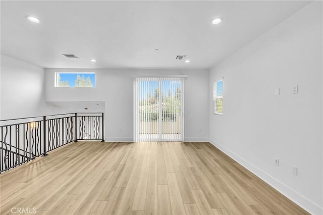 spare room with light wood-type flooring