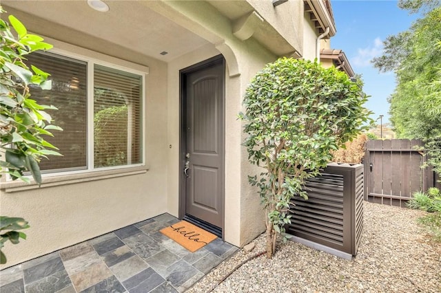 entrance to property featuring central air condition unit