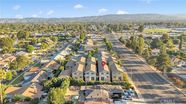 birds eye view of property featuring a mountain view