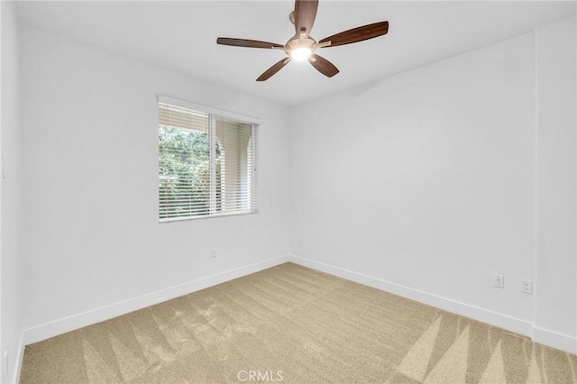 empty room with carpet floors and ceiling fan