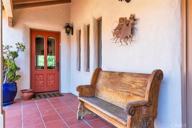 entrance to property with stucco siding