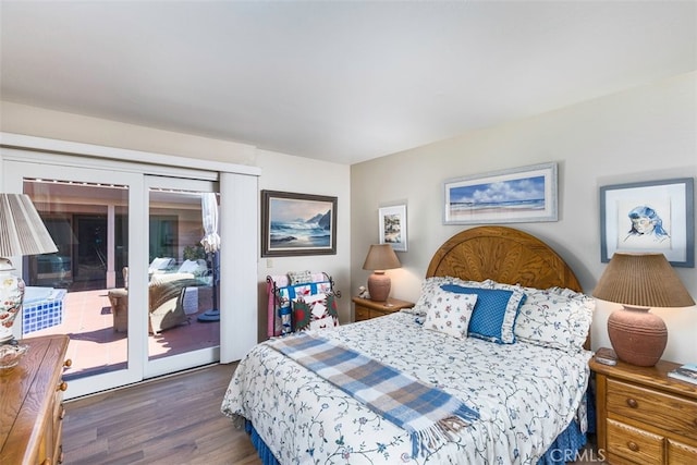 bedroom with wood finished floors and access to outside