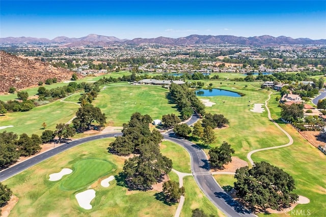 bird's eye view with golf course view and a water and mountain view