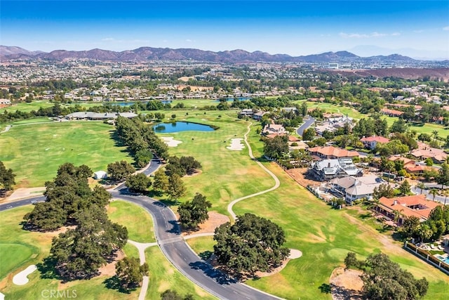 aerial view with a residential view, a water and mountain view, and view of golf course