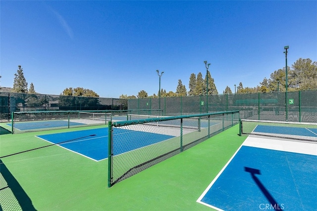 view of sport court with fence