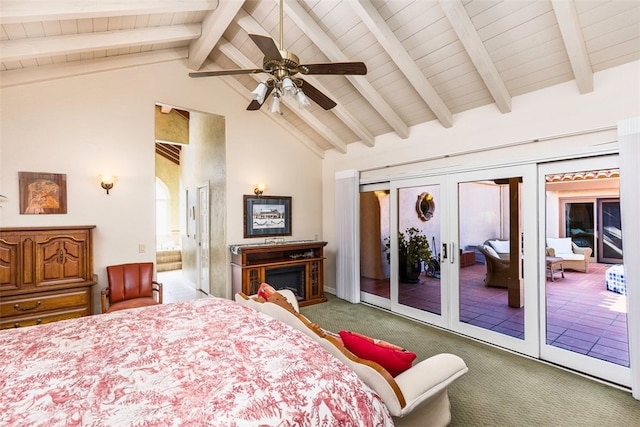 carpeted bedroom with lofted ceiling with beams, a fireplace, ceiling fan, french doors, and access to outside