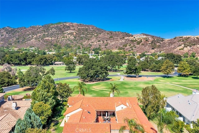 drone / aerial view featuring a mountain view and view of golf course