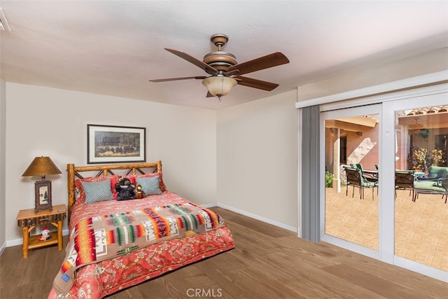 bedroom with wood finished floors, visible vents, baseboards, ceiling fan, and access to outside