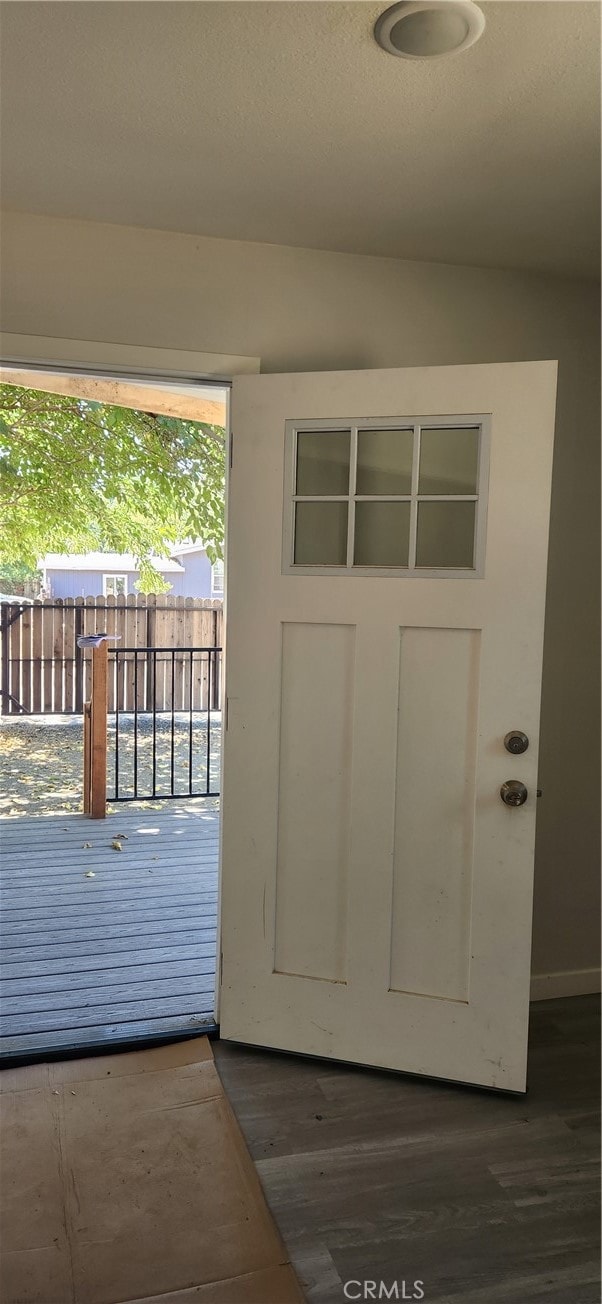 entryway with dark wood-type flooring