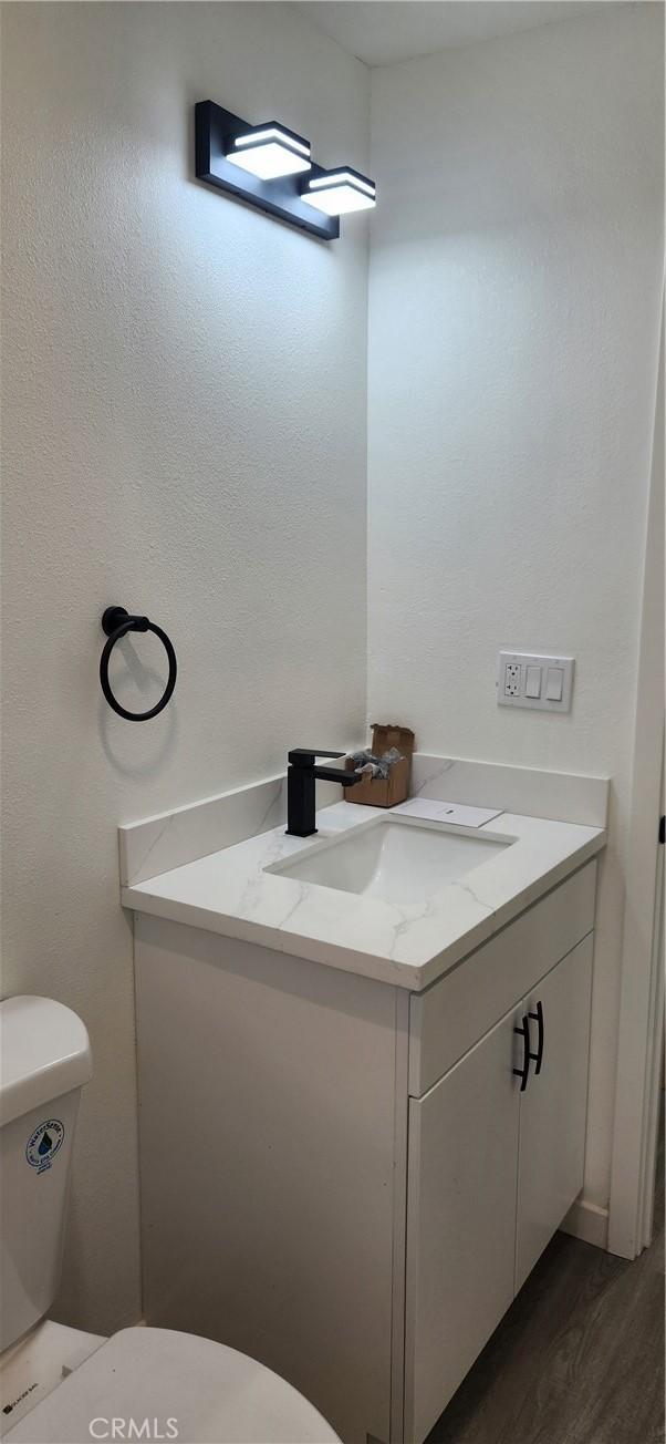 3590 Redwood St, Clearlake, CA 95422 - bathroom with vanity and wood finished floors