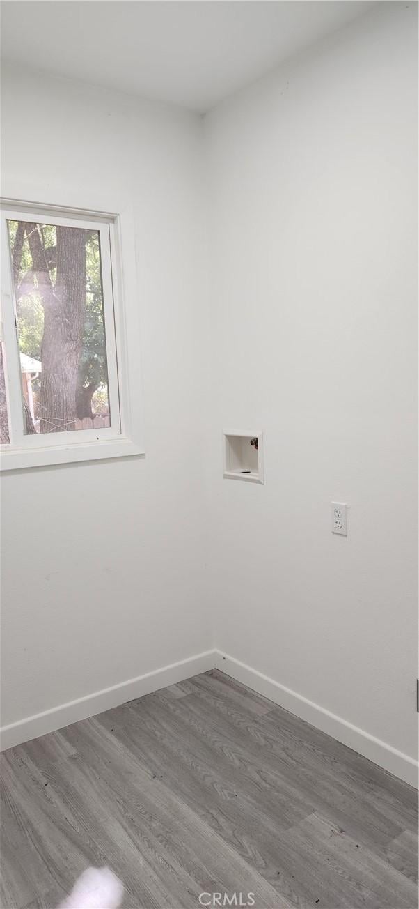 3590 Redwood St, Clearlake, CA 95422 - laundry area with wood finished floors and washer hookup