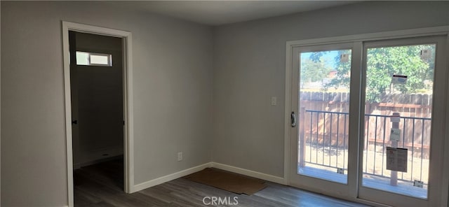 doorway with hardwood / wood-style floors