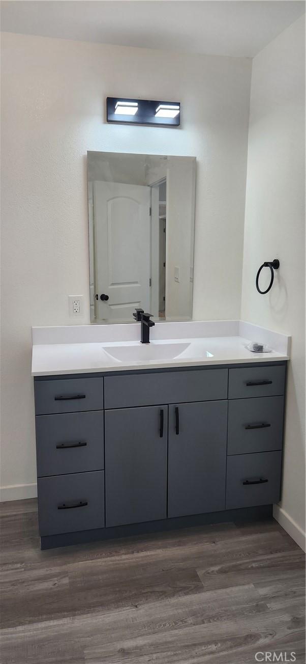3590 Redwood St, Clearlake, CA 95422 - bathroom with vanity and wood finished floors
