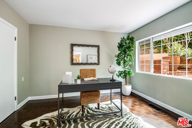 home office featuring dark parquet flooring