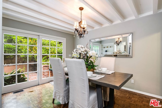 dining space featuring a notable chandelier, beam ceiling, and parquet flooring