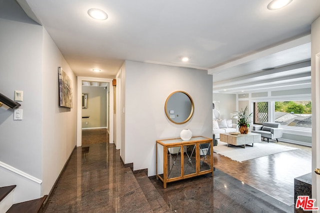 corridor featuring dark hardwood / wood-style floors